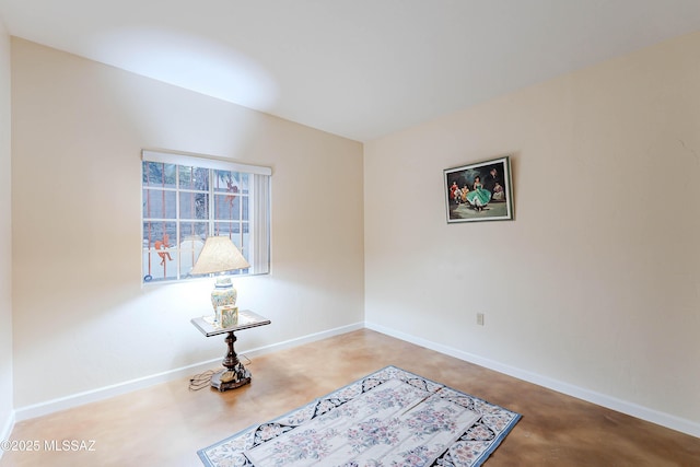 living area with vaulted ceiling