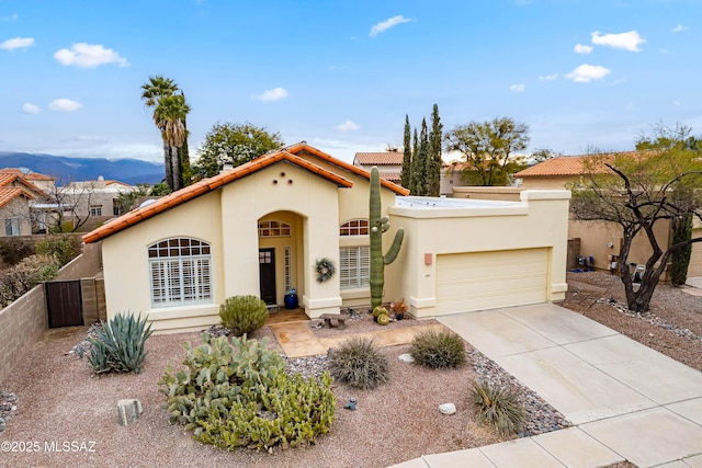 view of front facade with a garage and a mountain view