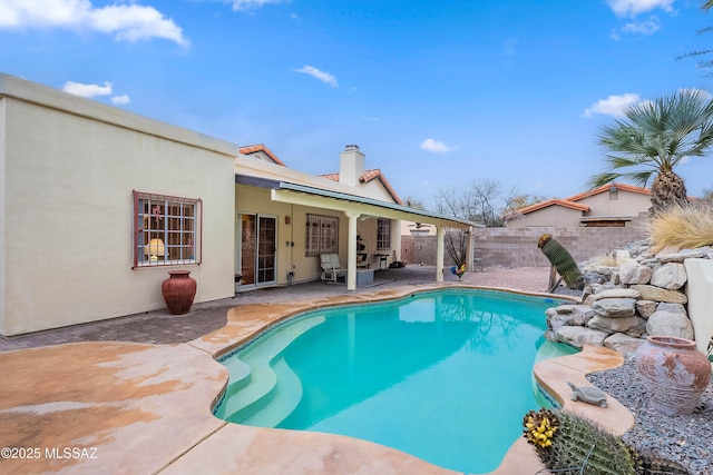 view of swimming pool with a patio area