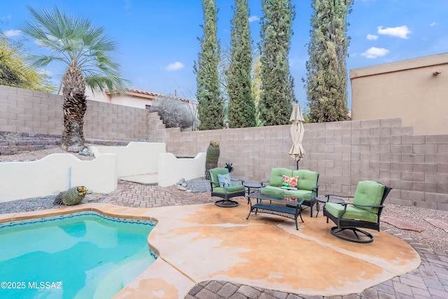 view of swimming pool with an outdoor living space and a patio