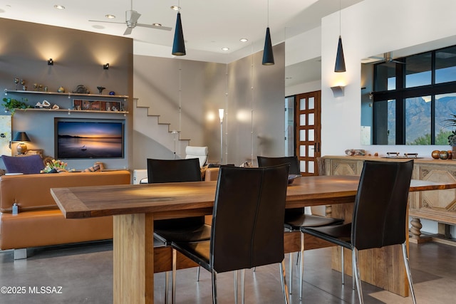 dining room featuring recessed lighting, ceiling fan, and stairway