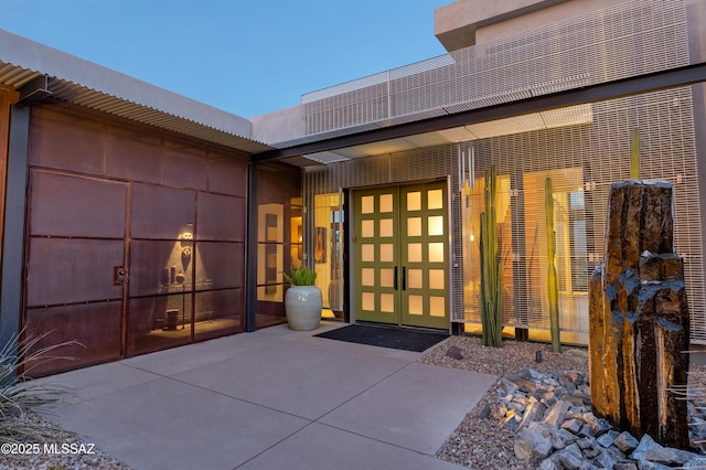 view of exterior entry featuring an attached garage