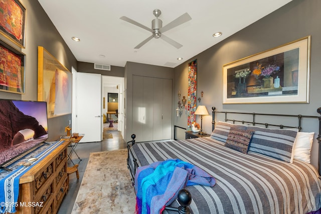 bedroom with concrete flooring, a closet, visible vents, and recessed lighting