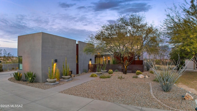 adobe home featuring stucco siding