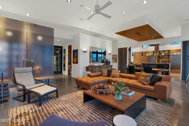 living room featuring a ceiling fan and recessed lighting