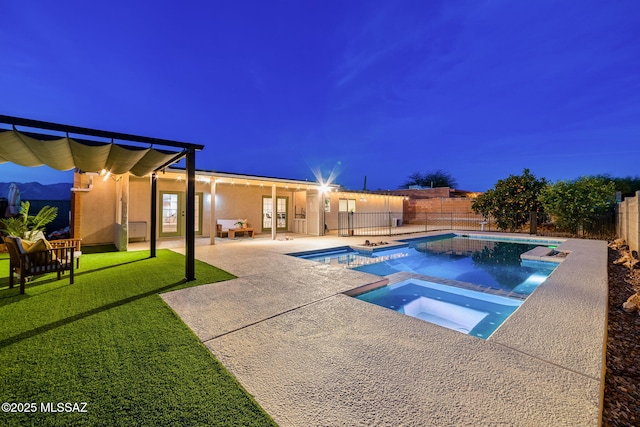 view of pool with an in ground hot tub, a lawn, and a patio