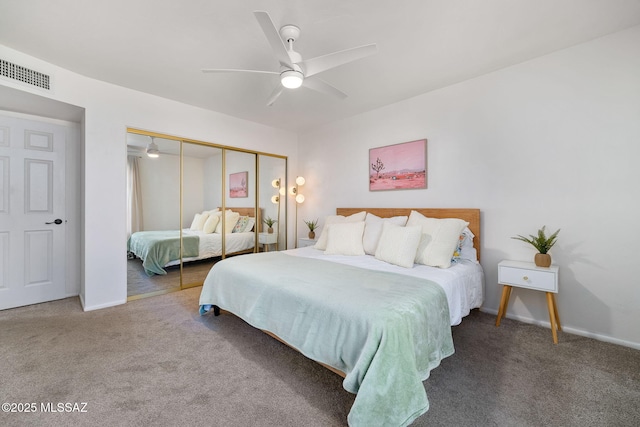 bedroom with ceiling fan, carpet floors, and a closet