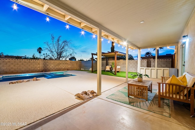 patio terrace at dusk with an outdoor hangout area and a pool with hot tub