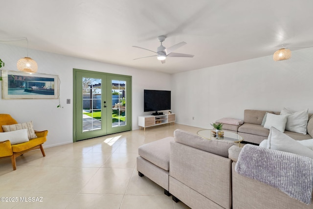 living room featuring light tile patterned floors, ceiling fan, and french doors