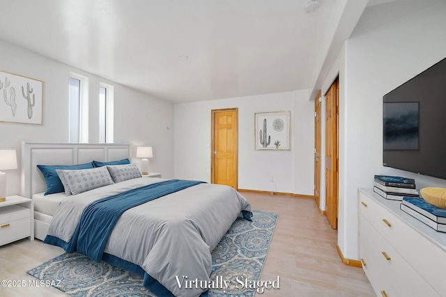 bedroom with light wood-type flooring