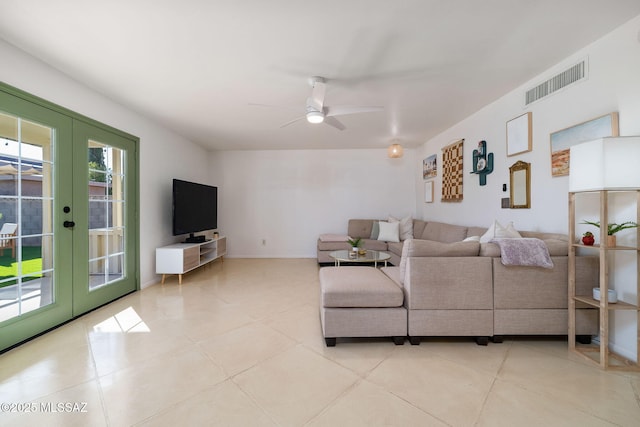 living room featuring french doors, ceiling fan, and light tile patterned flooring