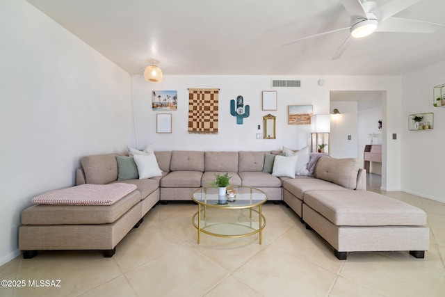 tiled living room featuring ceiling fan