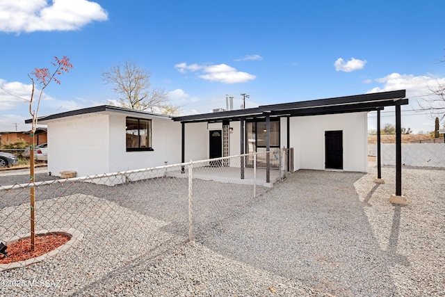 view of front of home featuring a carport