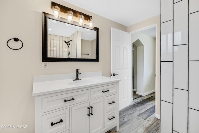 bathroom with hardwood / wood-style flooring and vanity