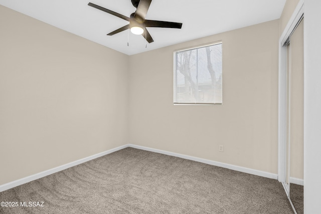 unfurnished bedroom featuring ceiling fan, carpet floors, and a closet