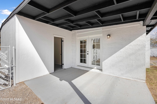 doorway to property featuring a patio area and french doors