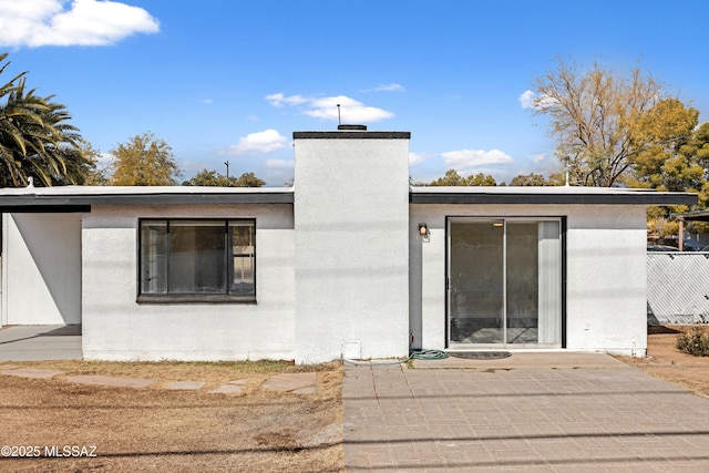 rear view of house featuring a patio