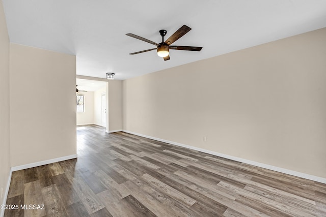 spare room featuring ceiling fan and light hardwood / wood-style flooring