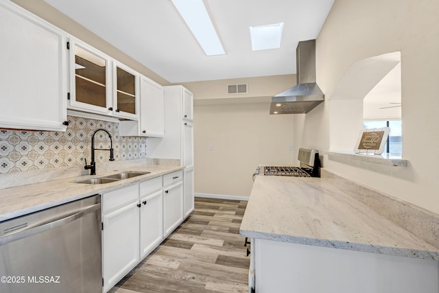 kitchen featuring white cabinetry, dishwasher, stove, and sink