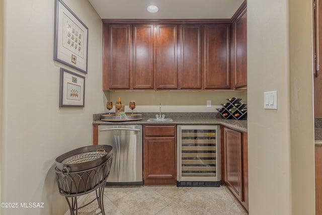 bar with sink, wine cooler, light tile patterned flooring, stainless steel dishwasher, and dark stone counters