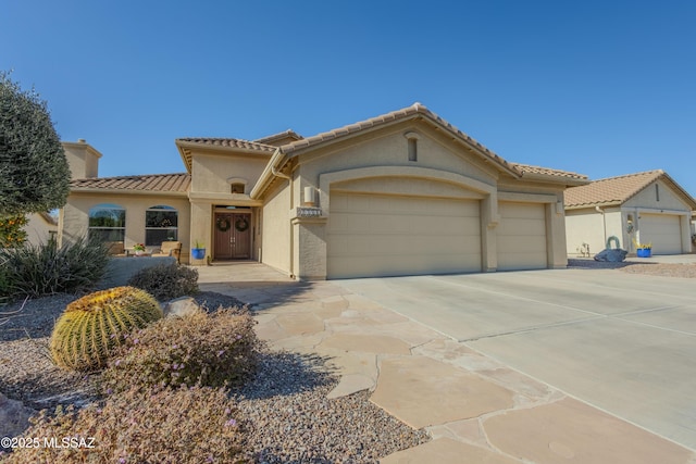 mediterranean / spanish-style house featuring a garage