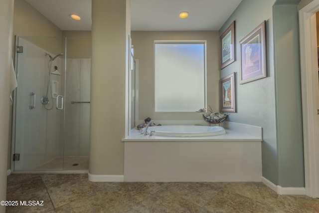 bathroom featuring plus walk in shower and tile patterned floors