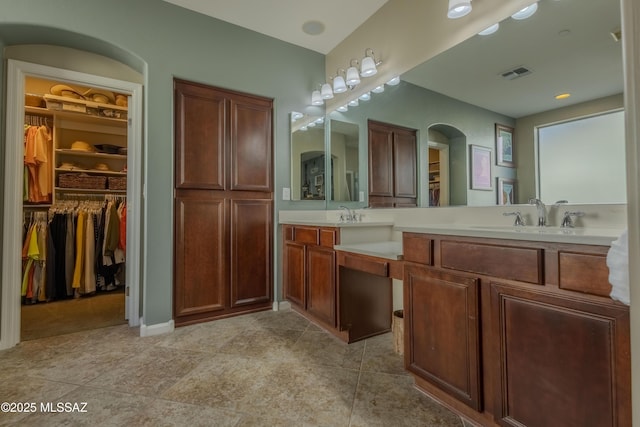 bathroom with tile patterned floors and vanity