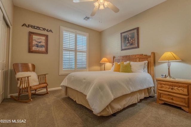 carpeted bedroom featuring ceiling fan and a closet