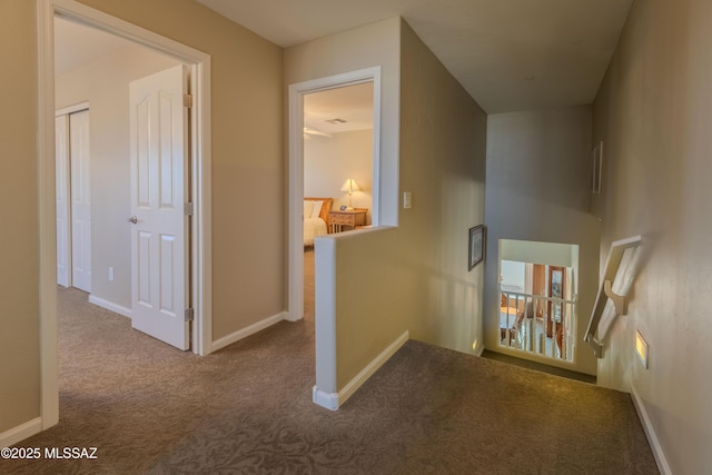 corridor featuring carpet flooring