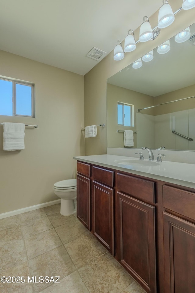 bathroom with vanity, tile patterned floors, and toilet