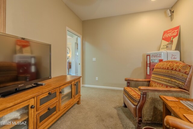 living area featuring light carpet