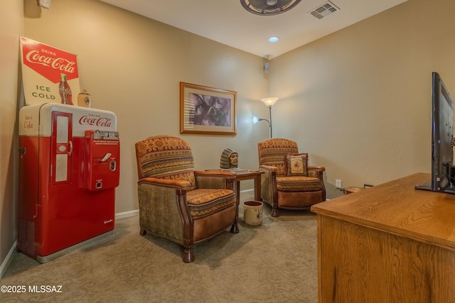 sitting room with carpet floors