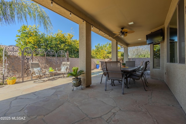 view of patio with ceiling fan