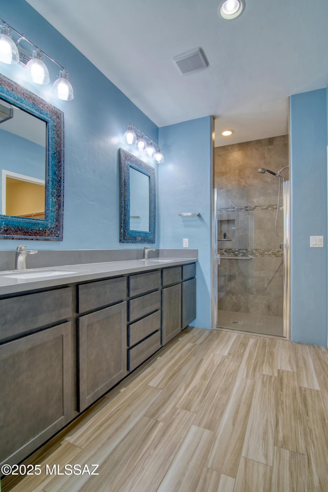 bathroom with vanity and walk in shower