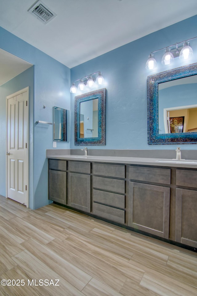 bathroom featuring vanity and hardwood / wood-style flooring