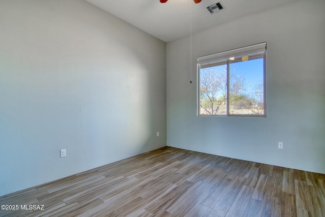 unfurnished room featuring ceiling fan and light hardwood / wood-style floors