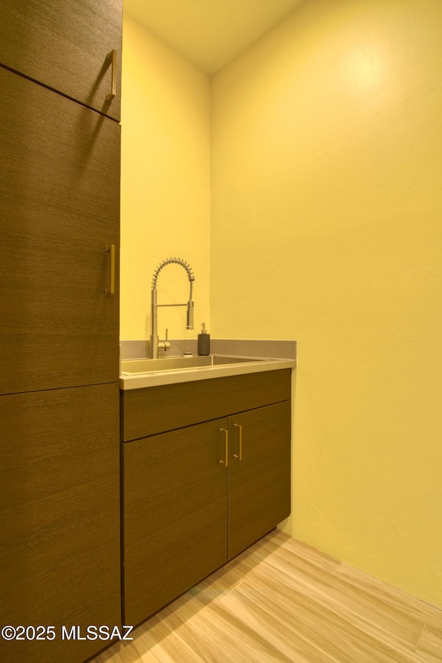 bathroom featuring vanity and hardwood / wood-style floors