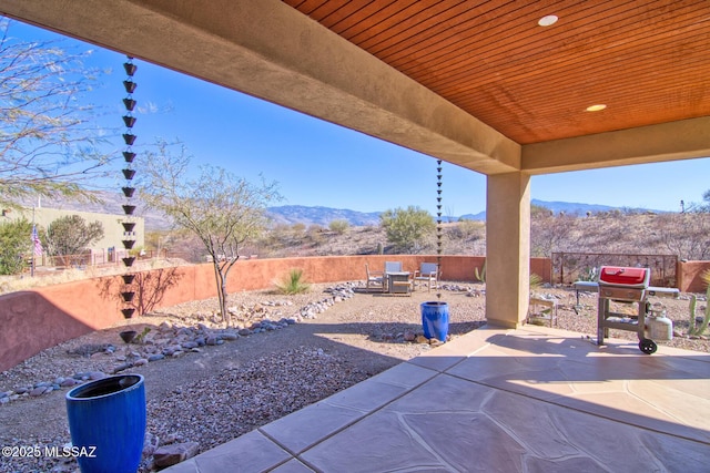 view of patio featuring area for grilling and a mountain view