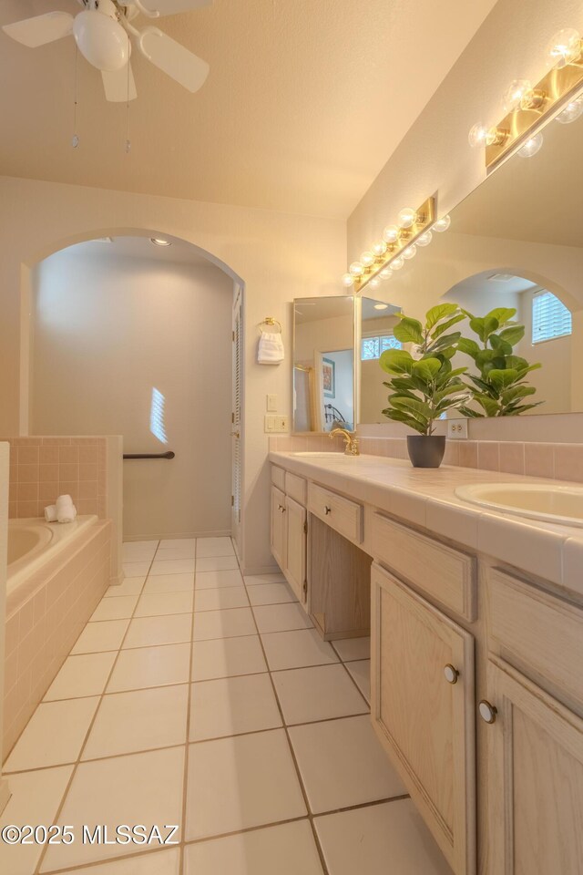 dining space with light tile patterned floors and ceiling fan