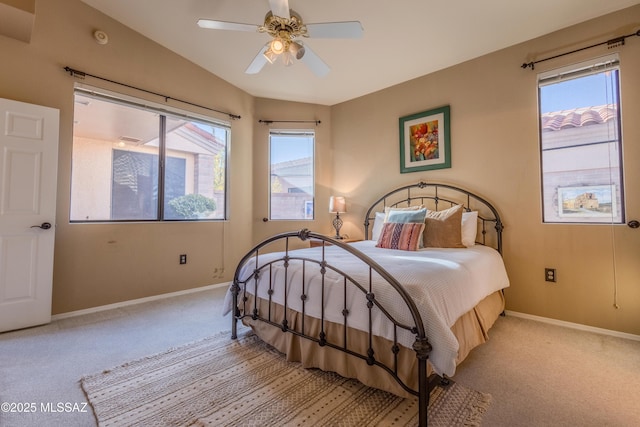 carpeted bedroom with lofted ceiling and ceiling fan