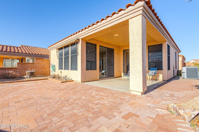 view of patio / terrace featuring central AC and fence