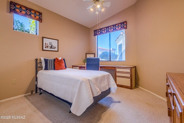 bedroom featuring ceiling fan, light colored carpet, and lofted ceiling