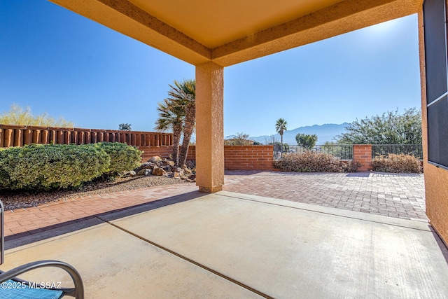 view of patio / terrace featuring a mountain view