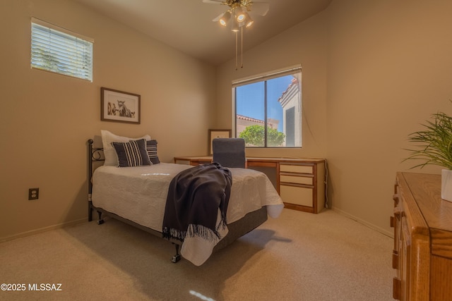 bedroom featuring baseboards, vaulted ceiling, and light colored carpet