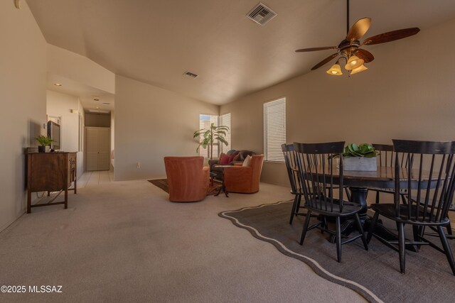 living room featuring lofted ceiling and light carpet