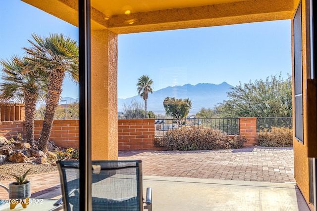 view of patio / terrace with a mountain view