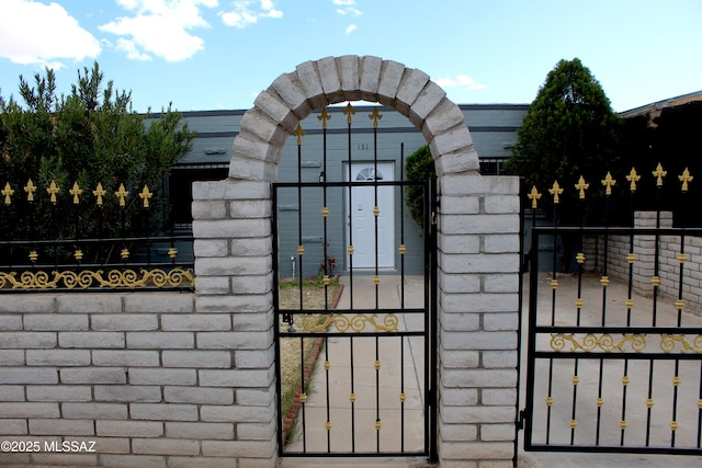 view of gate with fence