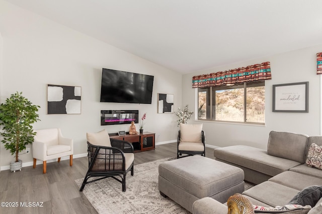 living room with hardwood / wood-style flooring and lofted ceiling