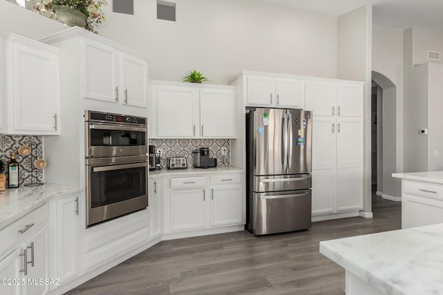 kitchen with white cabinetry and appliances with stainless steel finishes