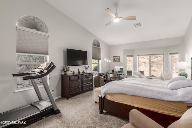 bedroom featuring high vaulted ceiling, light colored carpet, and ceiling fan